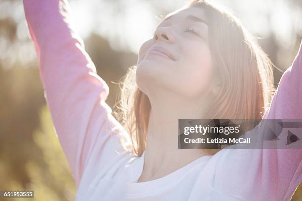 woman practicing yoga outside - harmony ストックフォトと画像