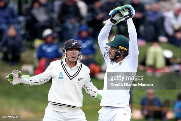 Faf du Plessis of South Africa plays a delivery as BJ Watling of New Zealand keeps wicket during day four of the First Test match between New Zealand...