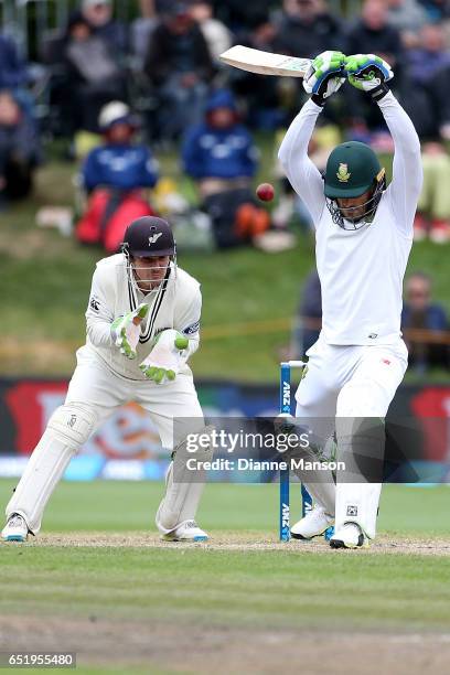 Faf du Plessis of South Africa plays a delivery as BJ Watling of New Zealand keeps wicket during day four of the First Test match between New Zealand...