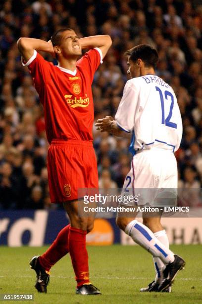Liverpool's Milan Baros reacts dejected after his shot hits the underside of the bar against FC Basle