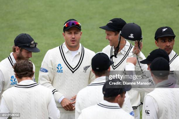 Kane Williamson Neil wagner and Trent Boult chat during day four of the First Test match between New Zealand and South Africa at University Oval on...