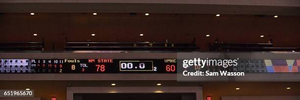 The scoreboard shows the final score after a semifinal game of the Western Athletic Conference Basketball Tournament between the New Mexico State...