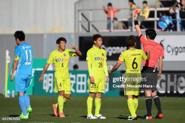 Takuya Marutani of Sanfrecce Hiroshima receives the red card after two yellow cards by referee Futoshi Nakamura during the J.League J1 match between...