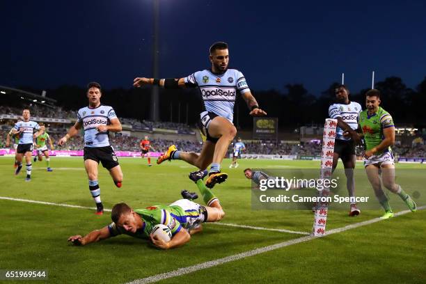 Jack Wighton of the Raiders scores a try during the round two NRL match between the Canberra Raiders and the Cronulla Sharks at GIO Stadium on March...