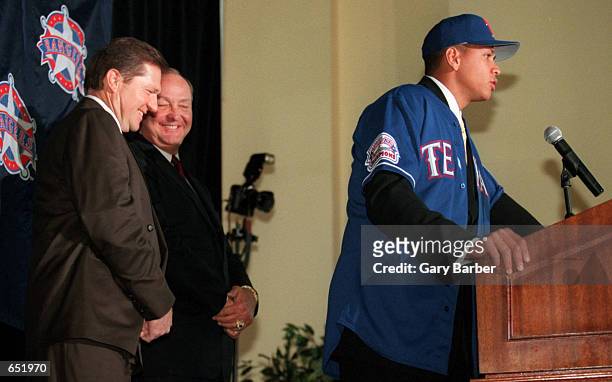 Newly signed Texas Ranger Alex Rodriguez, right, is introduced to the media by club owner Tom Hicks, center, and Rodriguez's agent Scott Boras during...
