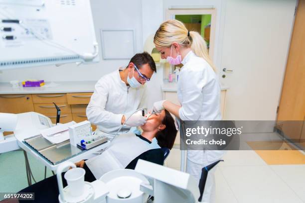 cute young women at the dentist - dental drill stock pictures, royalty-free photos & images