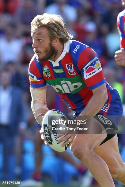 Nathan Ross of the Knights runs the ball during the round two NRL match between the Newcastle Knights and the Gold Coast Titans at McDonald Jones...