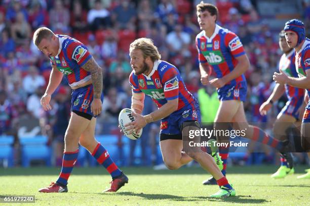 Nathan Ross of the Knights runs the ball during the round two NRL match between the Newcastle Knights and the Gold Coast Titans at McDonald Jones...