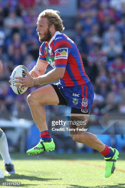 Nathan Ross of the Knights runs the ball during the round two NRL match between the Newcastle Knights and the Gold Coast Titans at McDonald Jones...