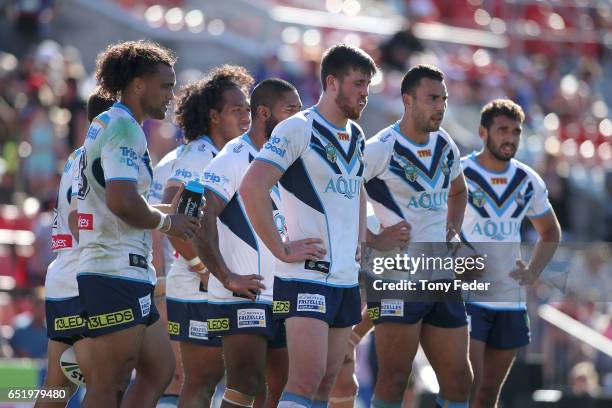 Titans players look dejected during the round two NRL match between the Newcastle Knights and the Gold Coast Titans at McDonald Jones Stadium on...