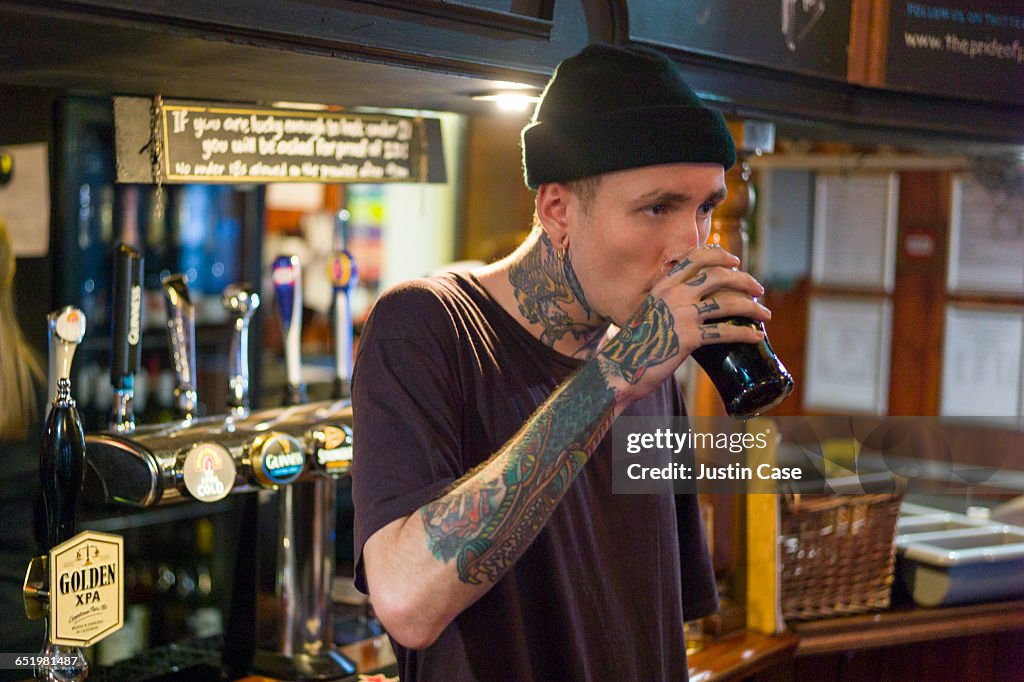 Man having a pint in the pub