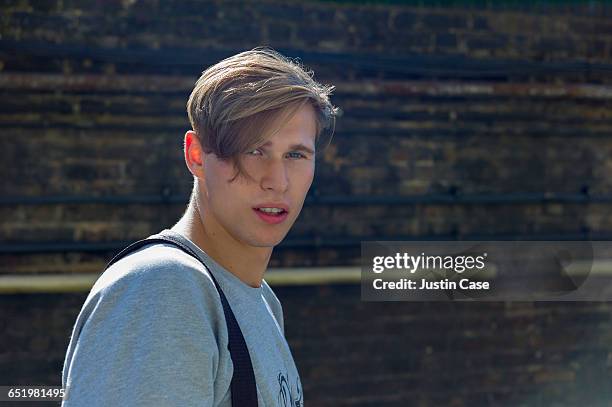 portrait of young man in the city - young man blue eyes stock pictures, royalty-free photos & images