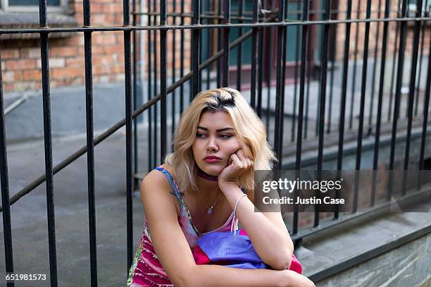 bored woman waiting for boyfriend - pouting fotografías e imágenes de stock