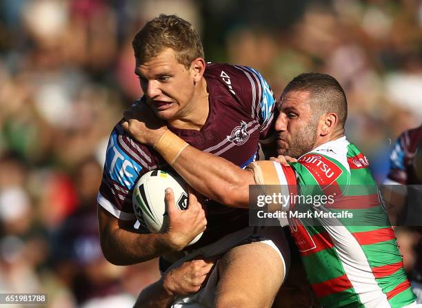 Tom Trbojevic of the Sea Eagles is tackled by Robbie Farah of the Rabbitohs during the round two NRL match between the Manly Sea Eagles and the South...