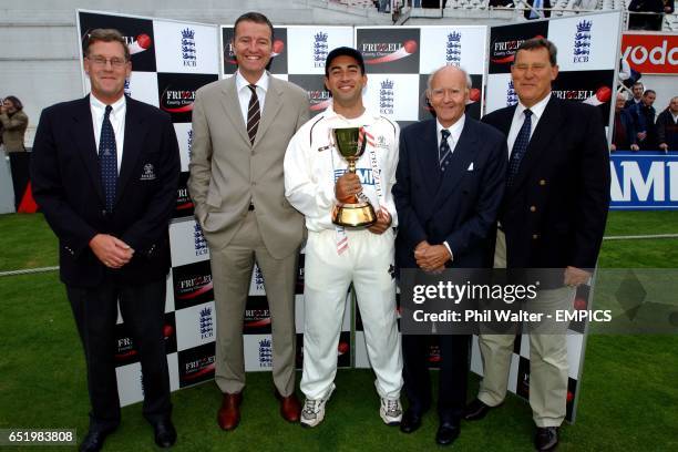 Surrey CCC Chief Executive Paul Sheldon , Chairman Mike Soper and President Brian Downing OBE with Captain Adam Hollioake holding the Frizzell County...