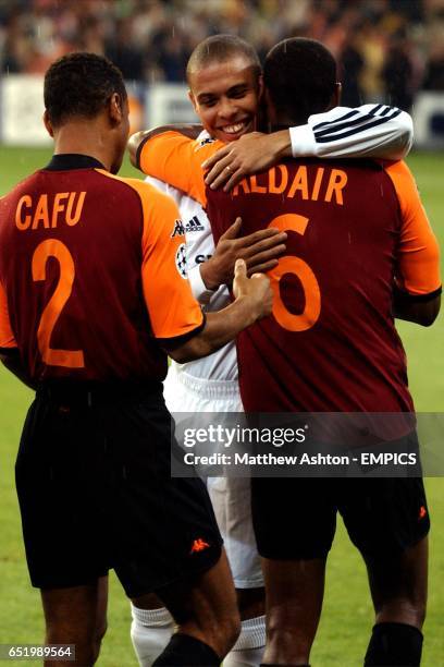 Real Madrid's Ronaldo greets his fellow Brazilians AS Roma's Cafu and Aldair