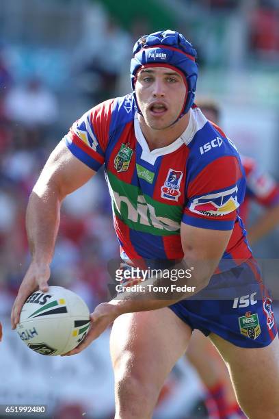Jamie Buhrer of the Knights loks to pass the ball during the round two NRL match between the Newcastle Knights and the Gold Coast Titans at McDonald...