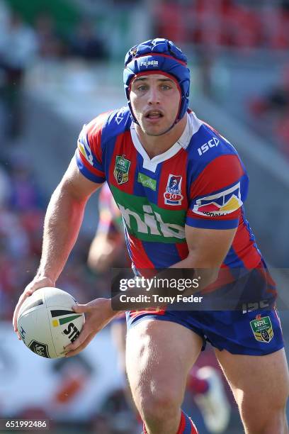 Jamie Buhrer of the Knights looks to pass the ball during the round two NRL match between the Newcastle Knights and the Gold Coast Titans at McDonald...