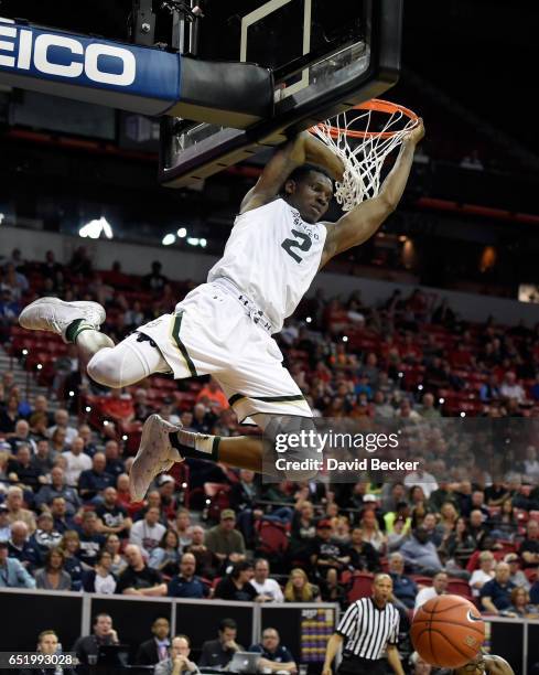 Emmanuel Omogbo of the Colorado State Rams dunks the ball against the San Diego State Aztecs during the first half of a semifinal game of the...