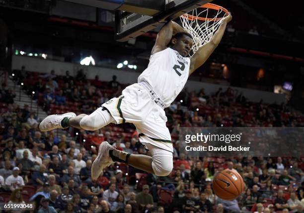Emmanuel Omogbo of the Colorado State Rams dunks the ball against the San Diego State Aztecs during the first half of a semifinal game of the...