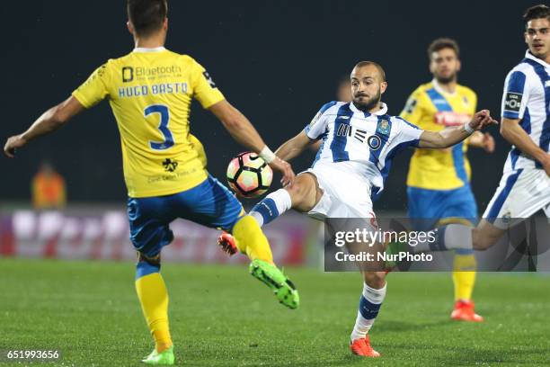 Porto's Portuguese midfielder Andre Andre vies with Arouca's Portuguese defender Hugo Bastos during Premier League 2016/17 match between FC Arouca...