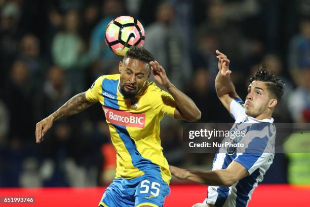 Porto's Portuguese forward Andre Silva in action with Arouca's Brazilian defender Nelsinho during Premier League 2016/17 match between FC Arouca and...