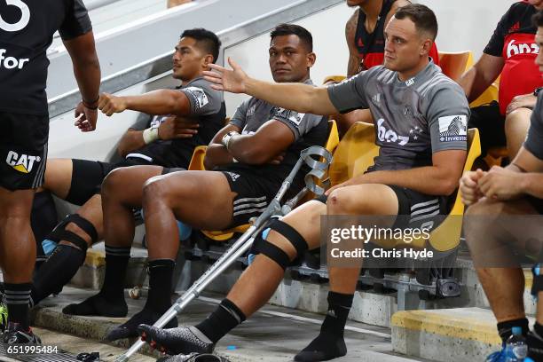 Israel Dagg of Crusaders sits on the bench after an injury during the round three Super Rugby match between the Reds and the Crusaders at Suncorp...