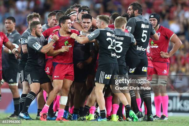 Reds and Crusaders grapple during the round three Super Rugby match between the Reds and the Crusaders at Suncorp Stadium on March 11, 2017 in...