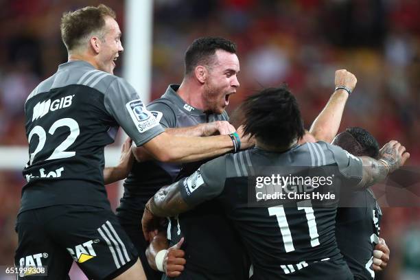 Crusaders celebrate winning the round three Super Rugby match between the Reds and the Crusaders at Suncorp Stadium on March 11, 2017 in Brisbane,...