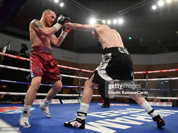 Antrim , United Kingdom - 10 March 2017; Gary Corcoran, right, in action against James Gorman during their welterweight bout in the Waterfront Hall...