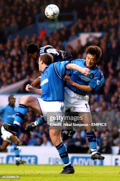 Manchester City's Richard Dunne and Sun Jihai combine to shut out Charlton Athletic's Shaun Bartlett