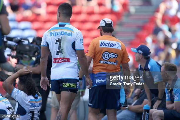Jarryd Hayne of the Titans leaves the ground after sustaining an injury during the round two NRL match between the Newcastle Knights and the Gold...