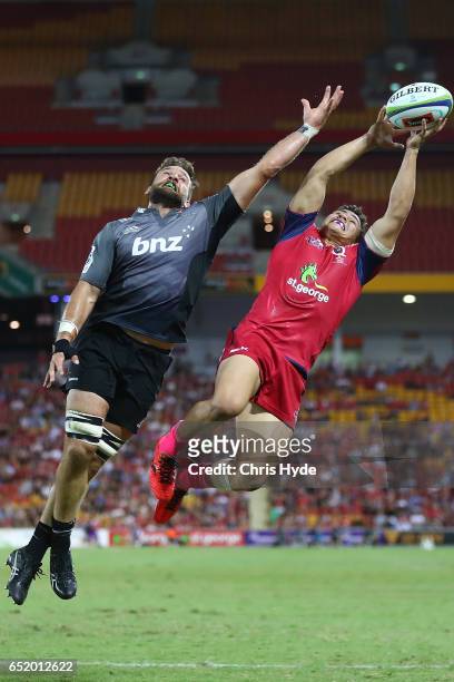 Heiden Bedwell-Curtis of Crusaders and Izaia Perese of the Reds compete for the ball during the round three Super Rugby match between the Reds and...