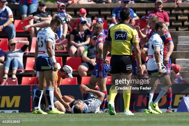 Jarryd Hayne of the Titans is injured during the round two NRL match between the Newcastle Knights and the Gold Coast Titans at McDonald Jones...