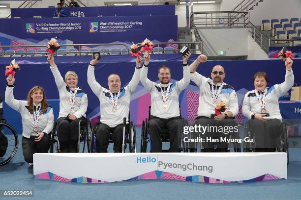 Head coach Sheila Swan, bronze medalists Angie Malone, Robert McPherson, Hugh Nibloe,Gregor Ewan and Aileen Neilson from Scotland celebrate in the...