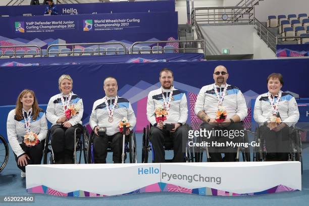 Head coach Sheila Swan, bronze medalists Angie Malone, Robert McPherson, Hugh Nibloe,Gregor Ewan and Aileen Neilson from Scotland celebrate in the...