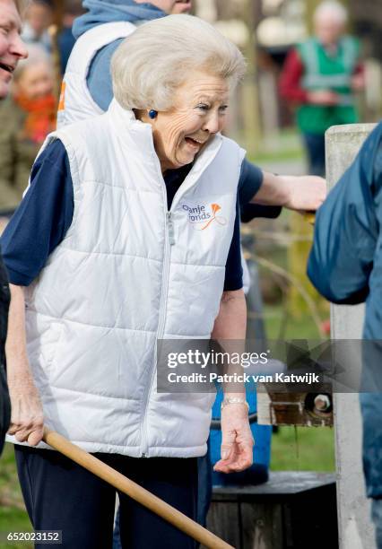 Princess Beatrix of The Netherlands laughs as she volunteers for NL Doet in the the kindergarden on March 11, 207 in IJsstelsteijn, The Netherlands....