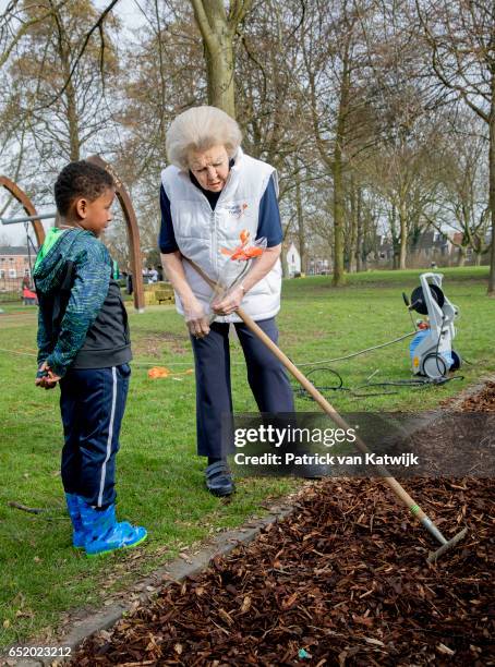 Princess Beatrix of The Netherlands speaks to children as she volunteers for NL Doet in the the kindergarden on March 11, 207 in IJsstelsteijn, The...