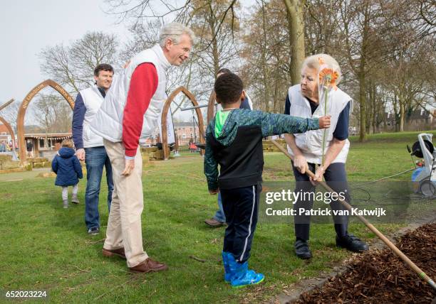 Princess Beatrix of The Netherlands speaks to children as she volunteers for NL Doet in the the kindergarden on March 11, 207 in IJsstelsteijn, The...