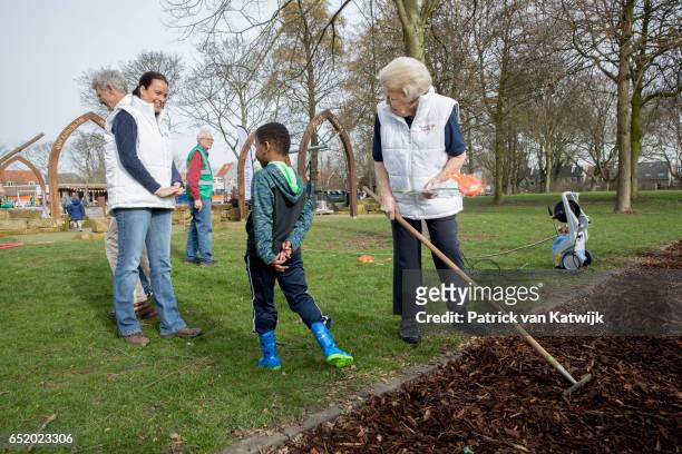 Princess Beatrix of The Netherlands speaks to children as she volunteers for NL Doet in the the kindergarden on March 11, 207 in IJsstelsteijn, The...