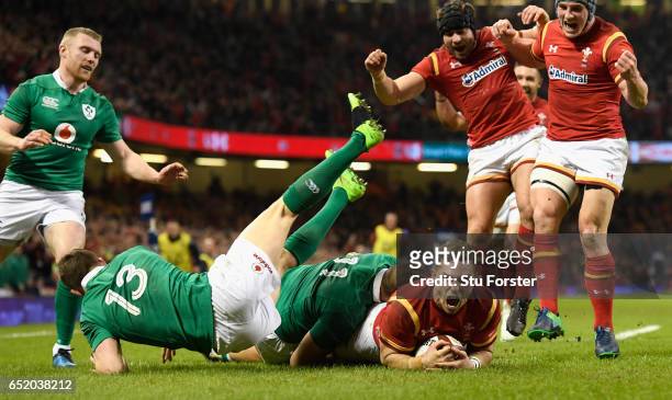 George North of Wales celebrates after scoring their first try during the Six Nations match between Wales and Ireland at the Principality Stadium on...