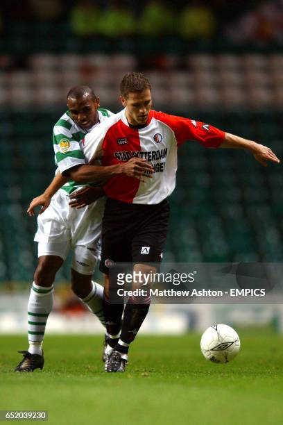 Celtic's Didier Agathe and Feyenoord's Patrick Paauwe battle for the ball
