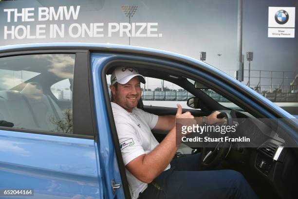 Duncan Stewart of Scotland with his BMW M3 hole in one prize during the third round of the Hero Indian Open at Dlf Golf and Country Club on March 11,...