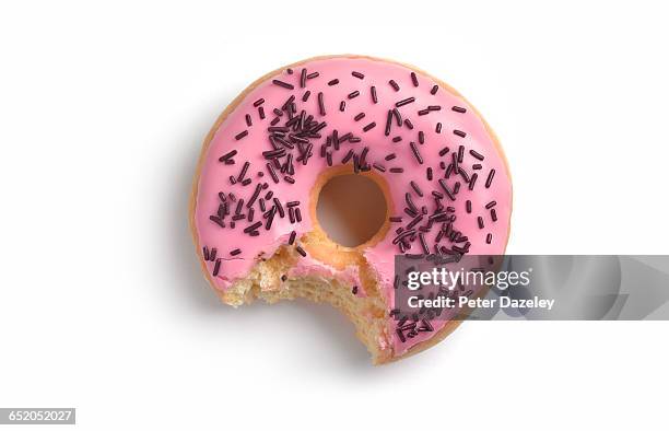 pink doughnut with bite - plain donut stock pictures, royalty-free photos & images