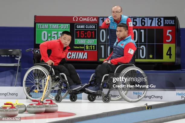 Head coach Jianrui Li, Wei Liu and Haitao Wang from China react during the final in the World Wheelchair Curling Championship 2017 - test event for...