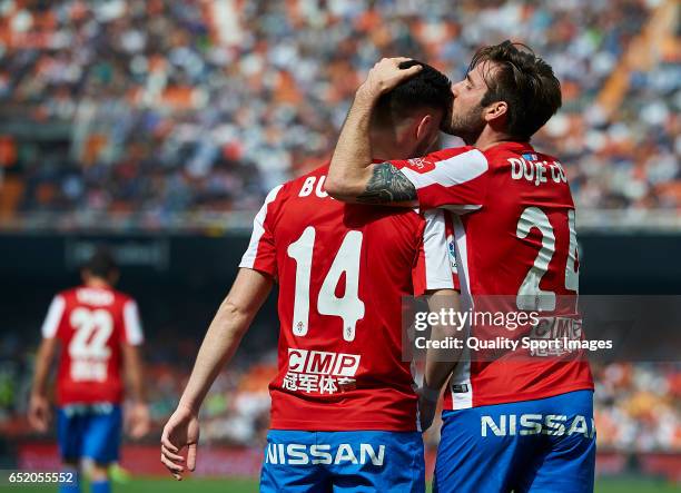 Duje Cop of Real Sporting de Gijon celebrates with Burgui after scoring a goal during the La Liga match between Valencia CF and Real Sporting de...