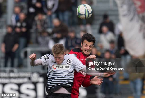 Gerrit Wegkamp of Aalen jumps for a header with Julian Leist of Grossaspach during the third league match between VfR Aalen and SG Sonnenhof...