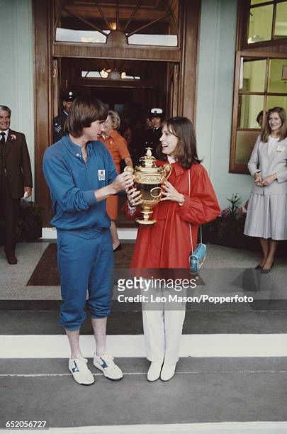 American tennis player Jimmy Connors pictured holding the Gentlemen's Singles Challenge CupTrophy with his wife Patti McGuire after winning the men's...