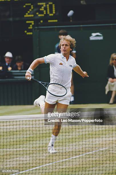 English tennis player John Lloyd pictured in action competing to reach the third round of the Men's Singles tournament at the Wimbledon Lawn Tennis...