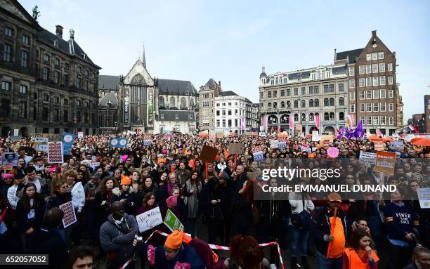 People take part in the "Womens March for united Netherlands" calling for people across the country to vote against hate ahead of the Dutch...